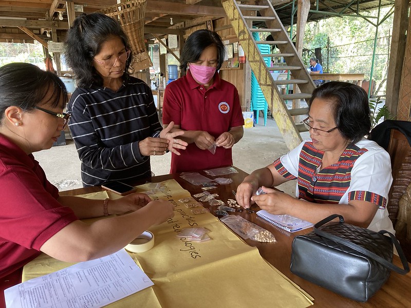 PIKP staff and partners divide heirloom seeds into small packages to be distributed to participants during a home gardening workshop help in Baguio City, Philippines.