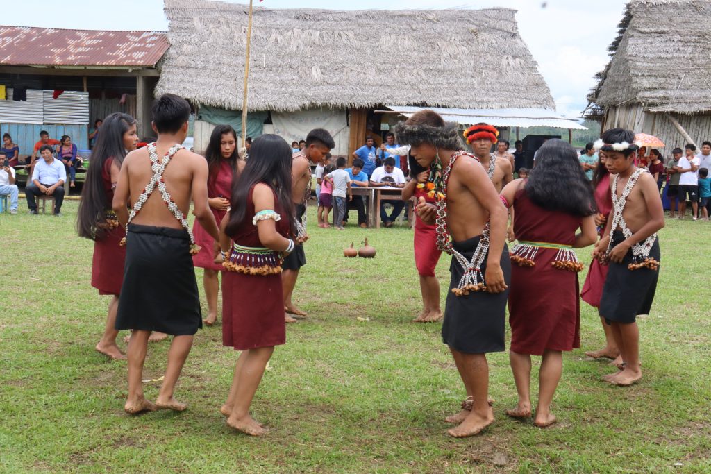 Indigenous youth dancing at a festival in Peru