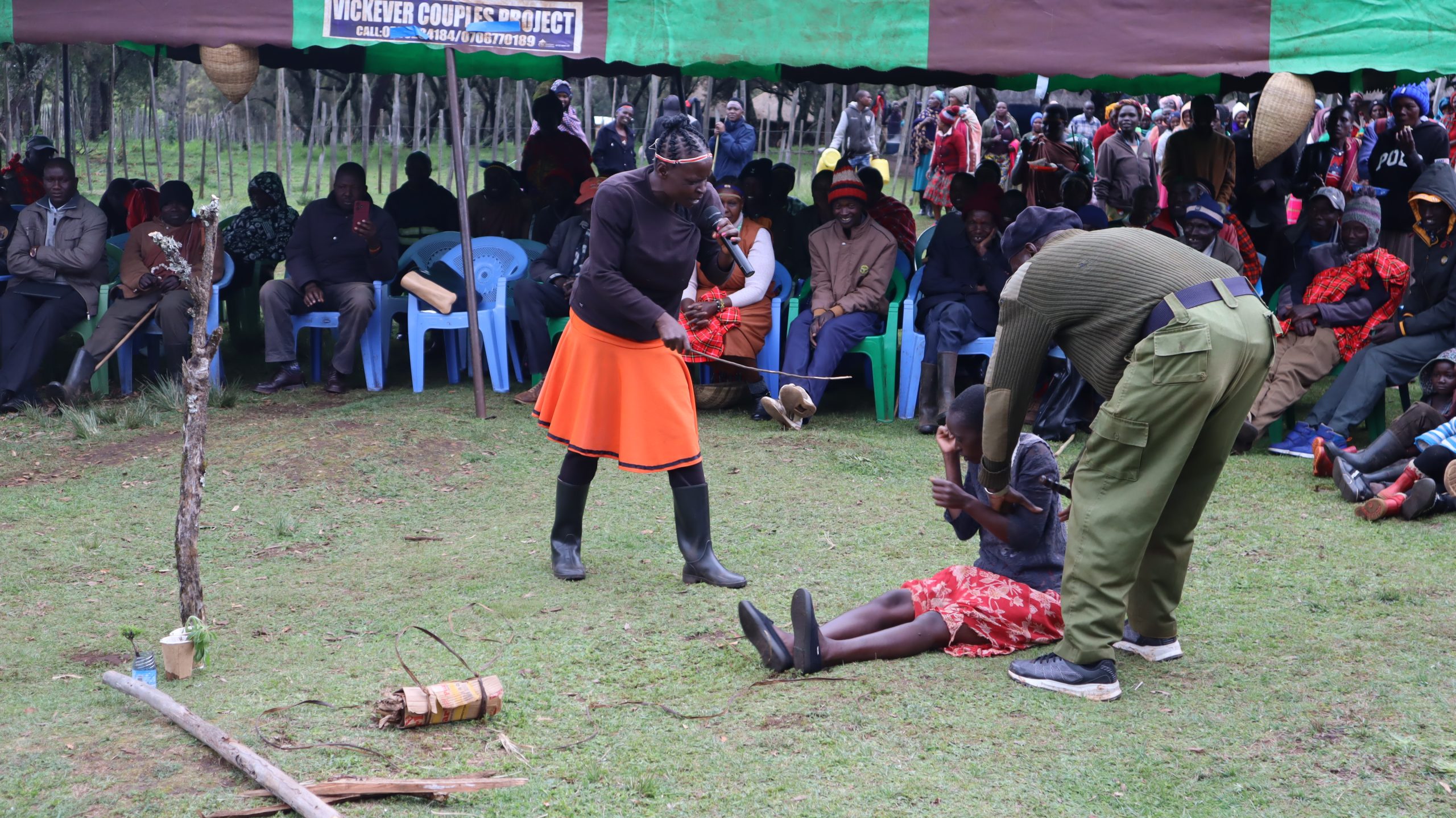 Women perform a skit to discourage deforestation.